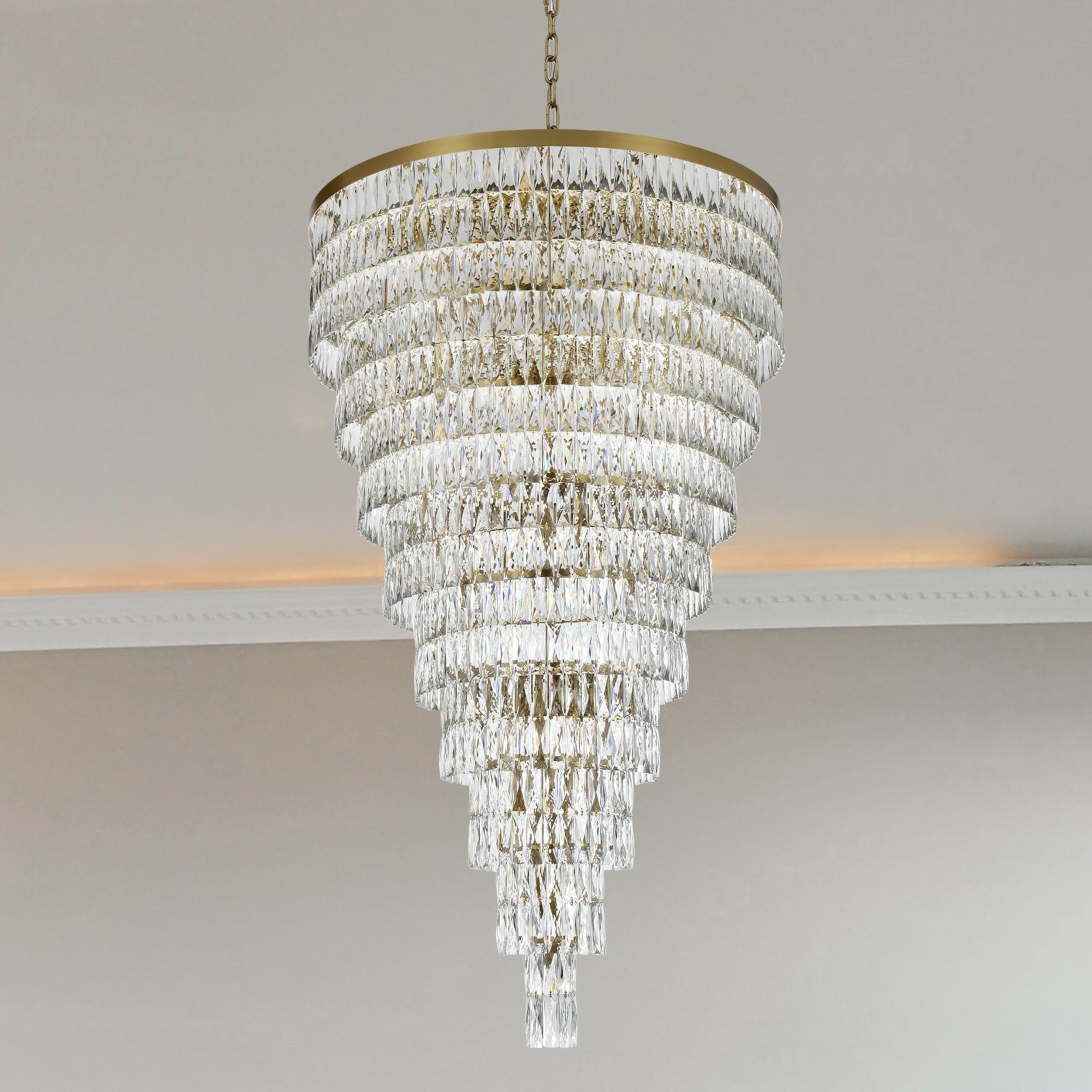 A Grand Chandelier with a Satin-Gold Iron Frame and Clear Crystal Accents