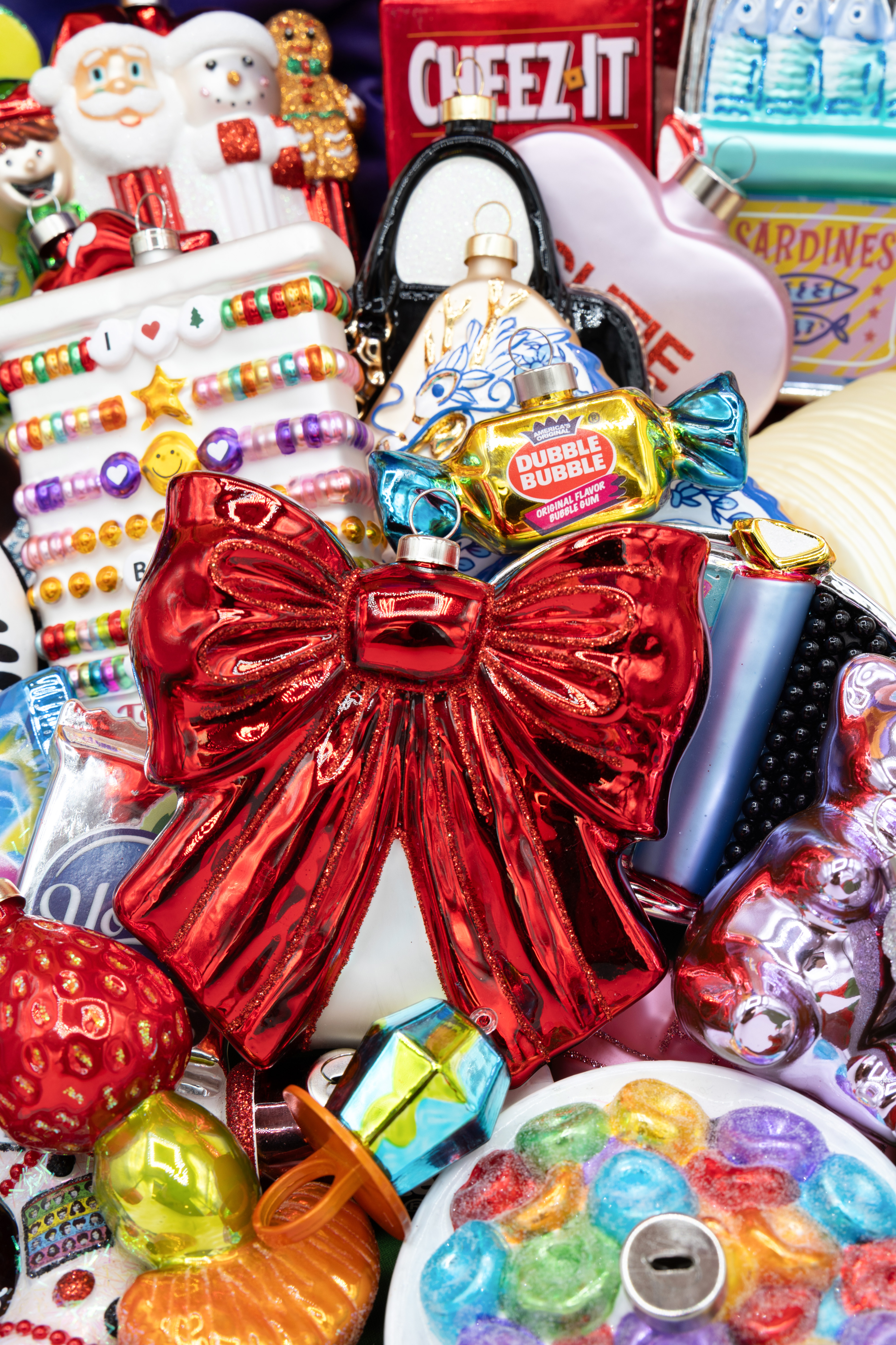 This glossy red glass bow brings instant drama and holiday cheer with its high-shine finish and sculptural shape. A statement piece that feels classic, confident, and ready to party!