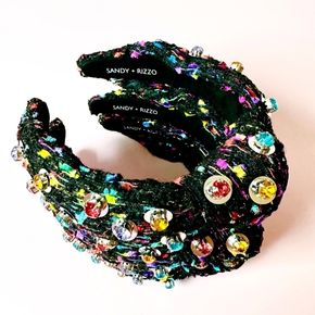 Add instant sparkle and color to any outfit with this black knotted headband, embellished with multicolored stones and silver sequins.
