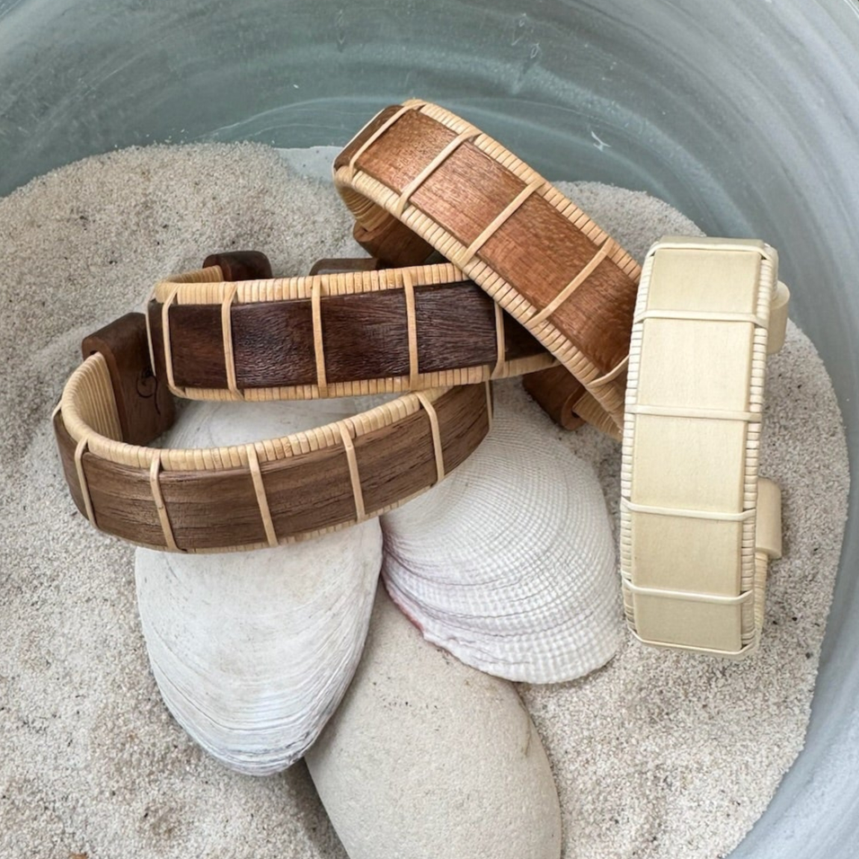 For a Strength That Shines Through . With bold lines and open space, the 3/4" cuff honors quiet power and presence. Available in Cherry, Holly, Rosewood, Walnut, and 5 sizes.