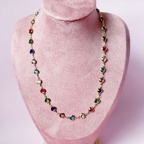 Add a pop of color to your look with our Rainbow Heart Necklace! The 17" multicolored crystal heart is held together by a convenient magnetic clasp, making it effortless to wear. 