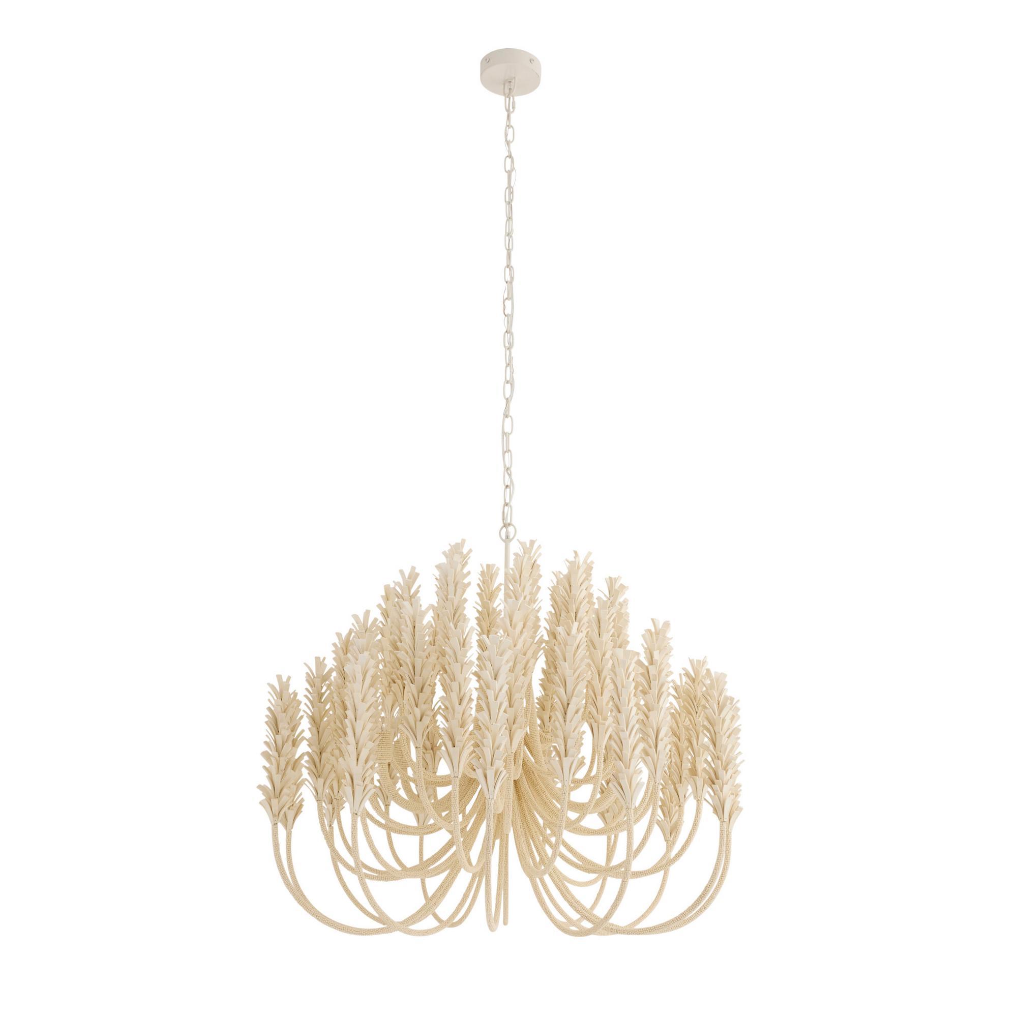 With beaded stems adorned with layers of ivory coconut shell, the elegant arms are finished with a flourish.