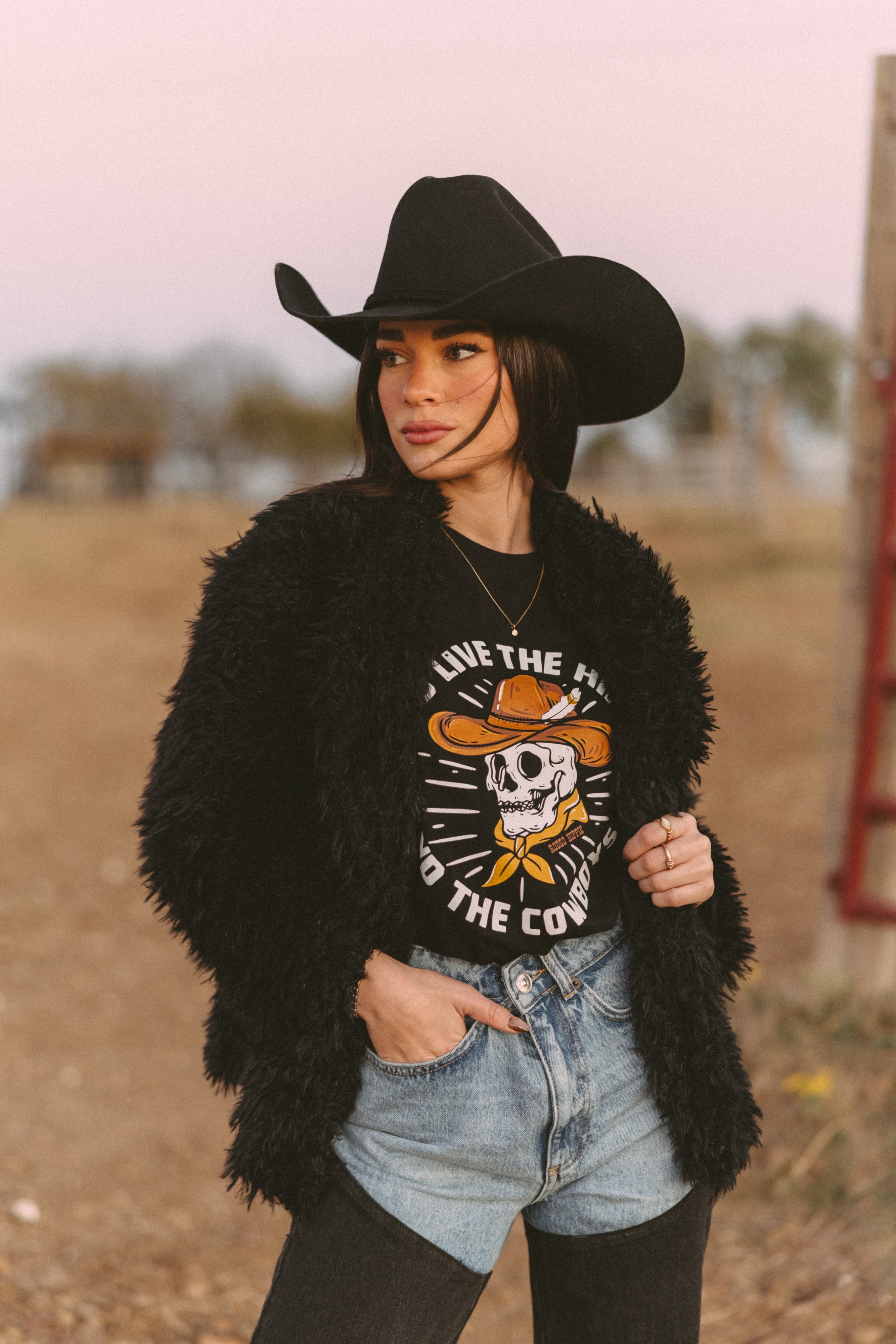 Long Live The Hippies & The Cowboys printed on a black tee