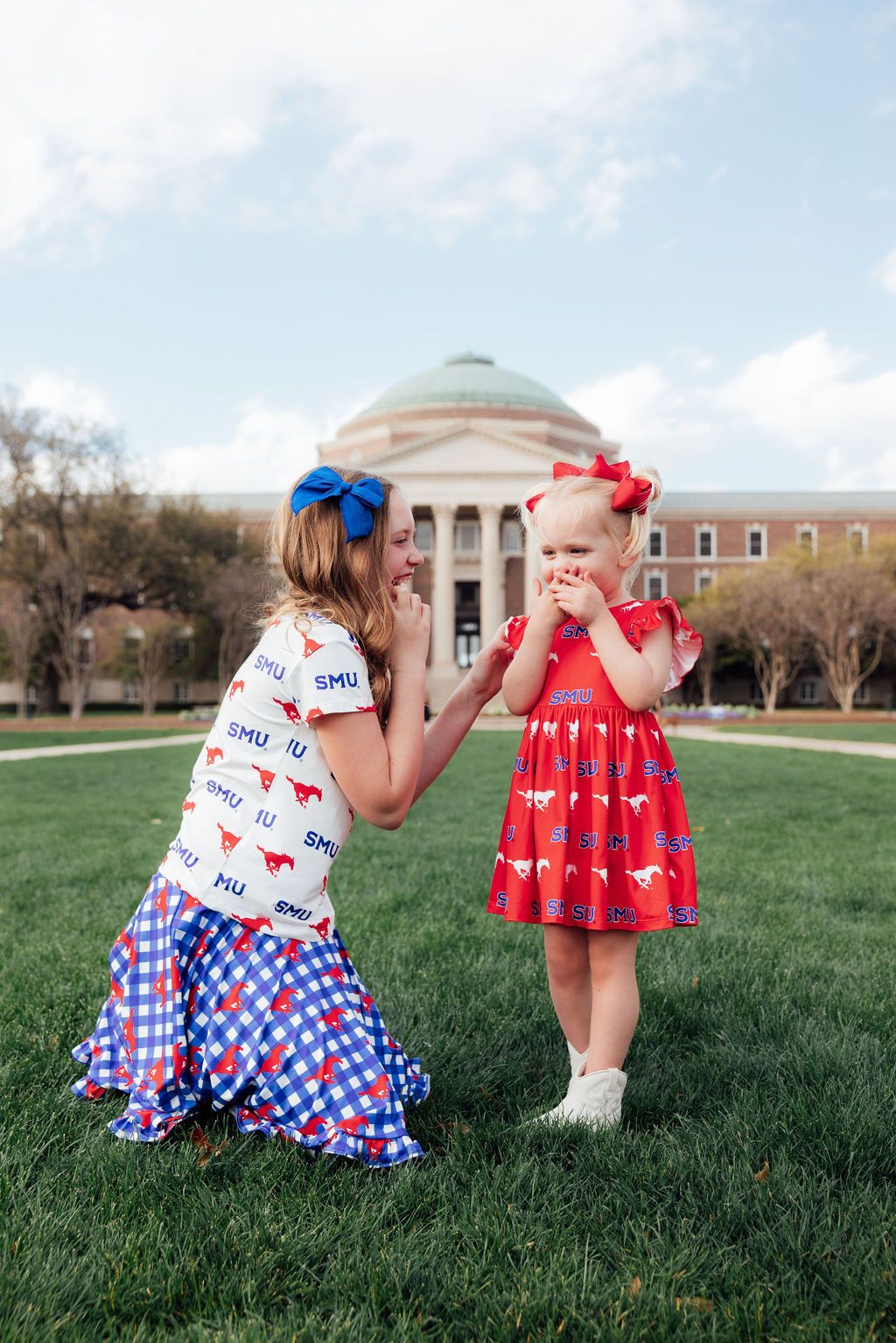 A spirited collegiate game day collection featuring twirl dresses, bodysuits, satin jackets, leggings, ruffle tees, and skorts—perfect for game day, spirit day, or everyday play!