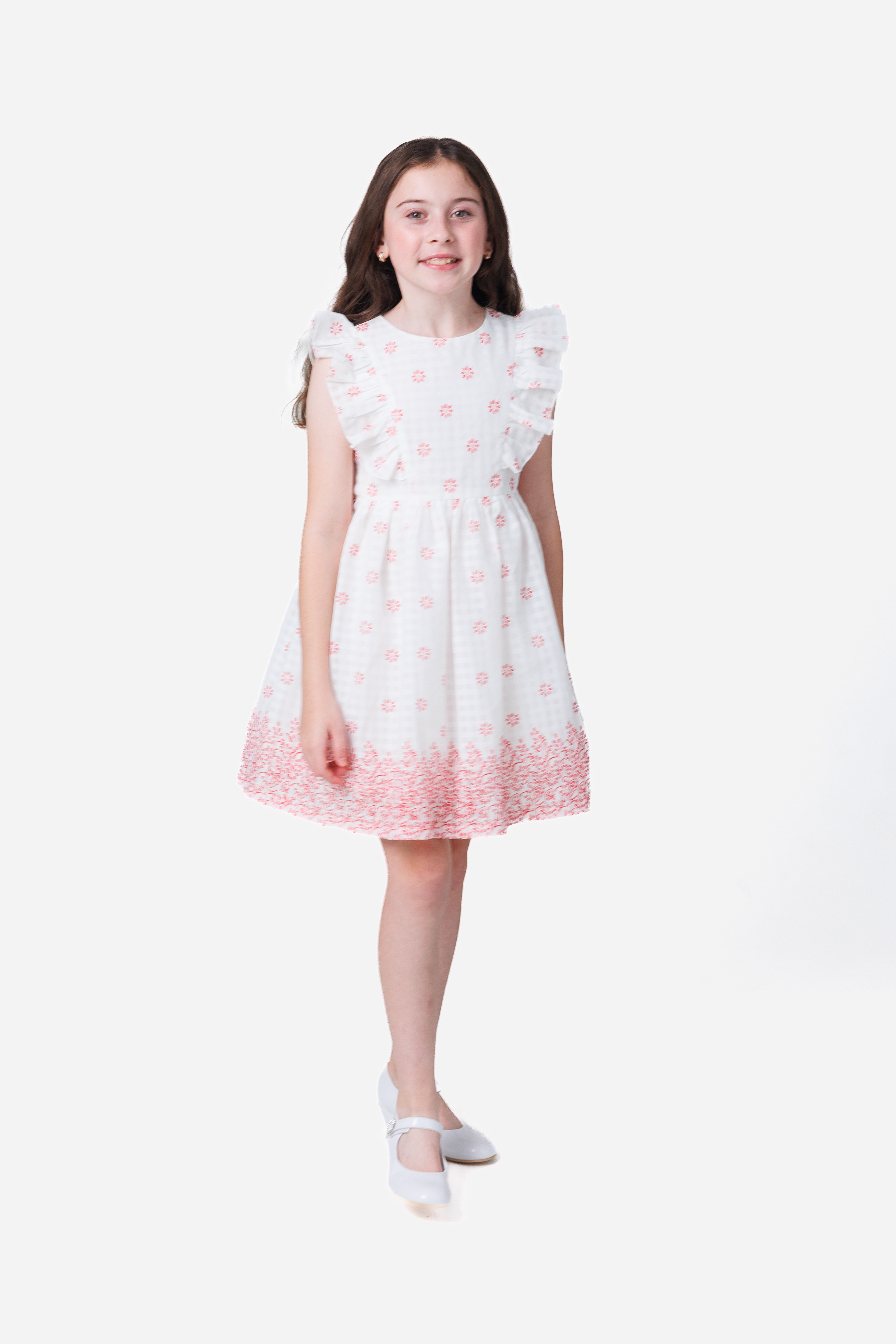 White knee length dress with red detailing.
