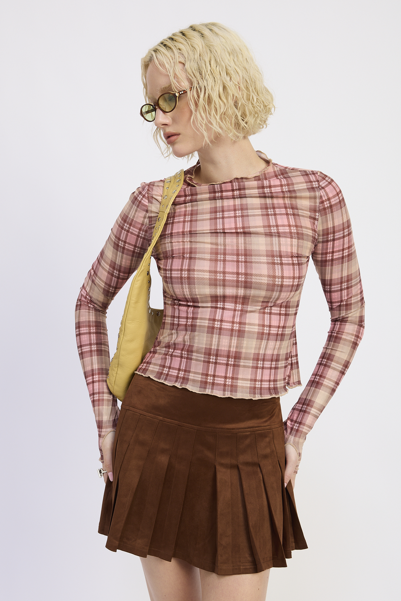 High neck long sleeve top with a chocolate brown mini skirt
