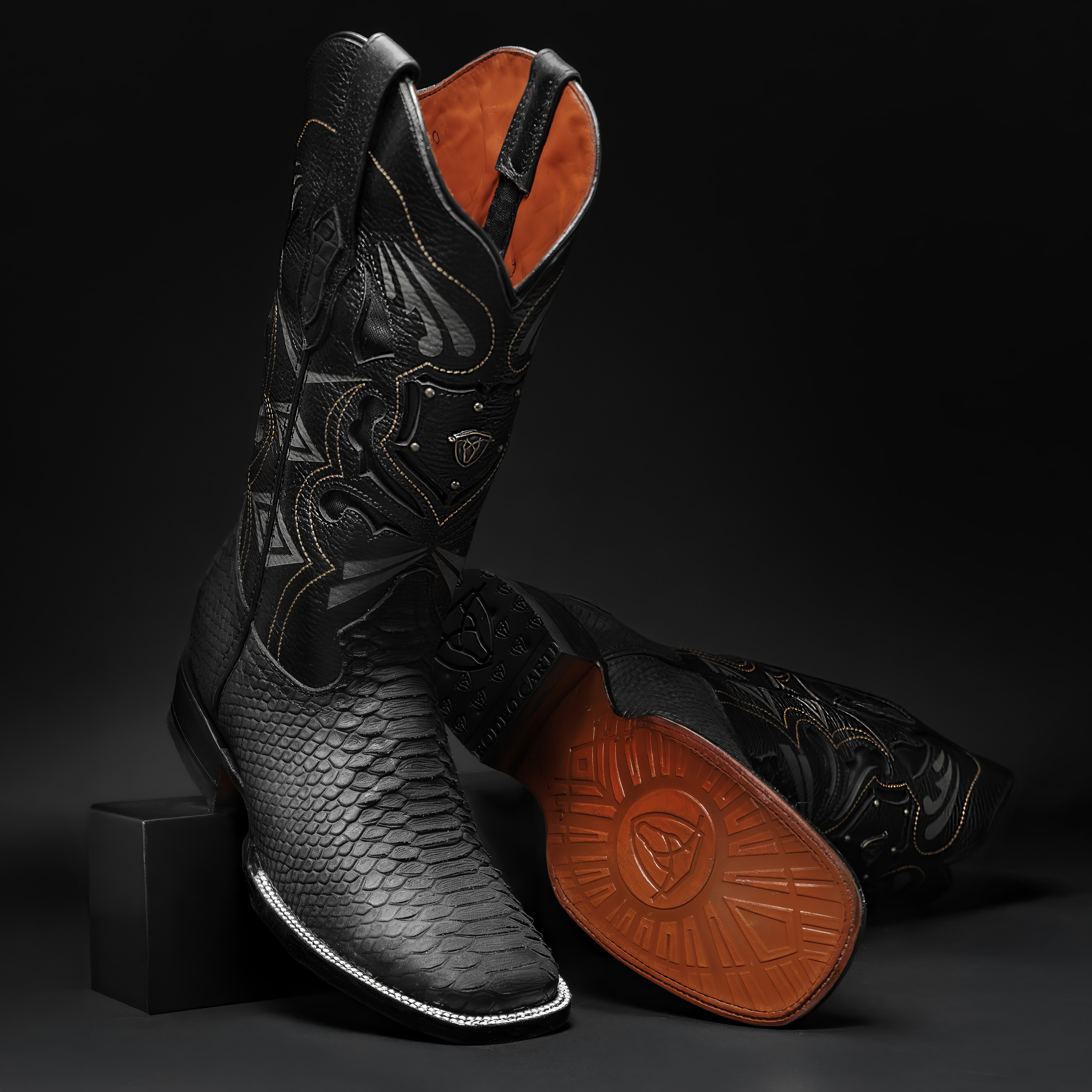  Featuring a sleek square toe and striking python-inspired texture, these boots blend bold design with refined elegance