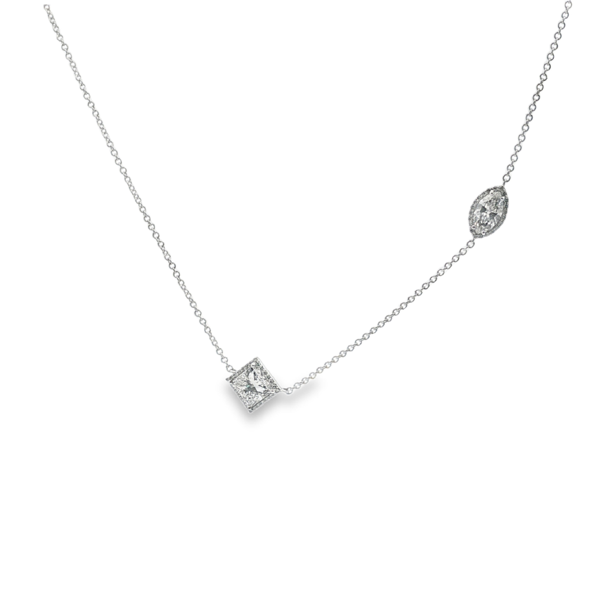 Exquisitely crafted, this diamond necklace features a delicate silver chain in white gold, lending a touch of understated elegance. 