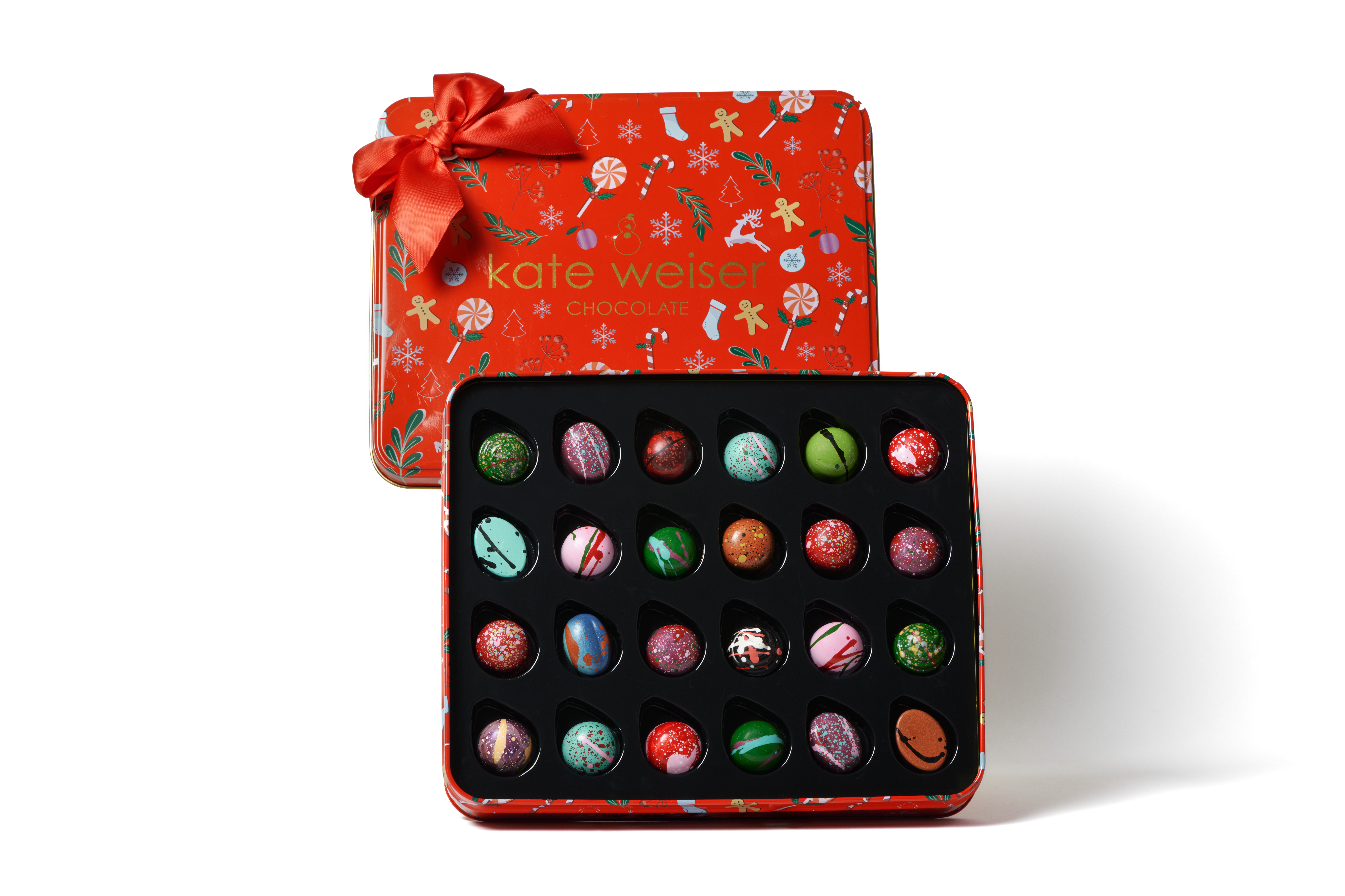 Unwrap the magic of the season with our 24-Piece Holiday Collection, beautifully nestled in a holiday keepsake tin. 