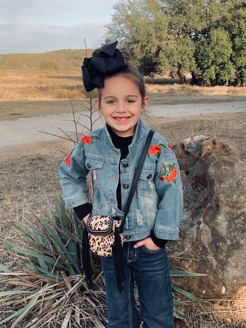 Is there anything cuter than a lil' cowgirl and her very own handbag??