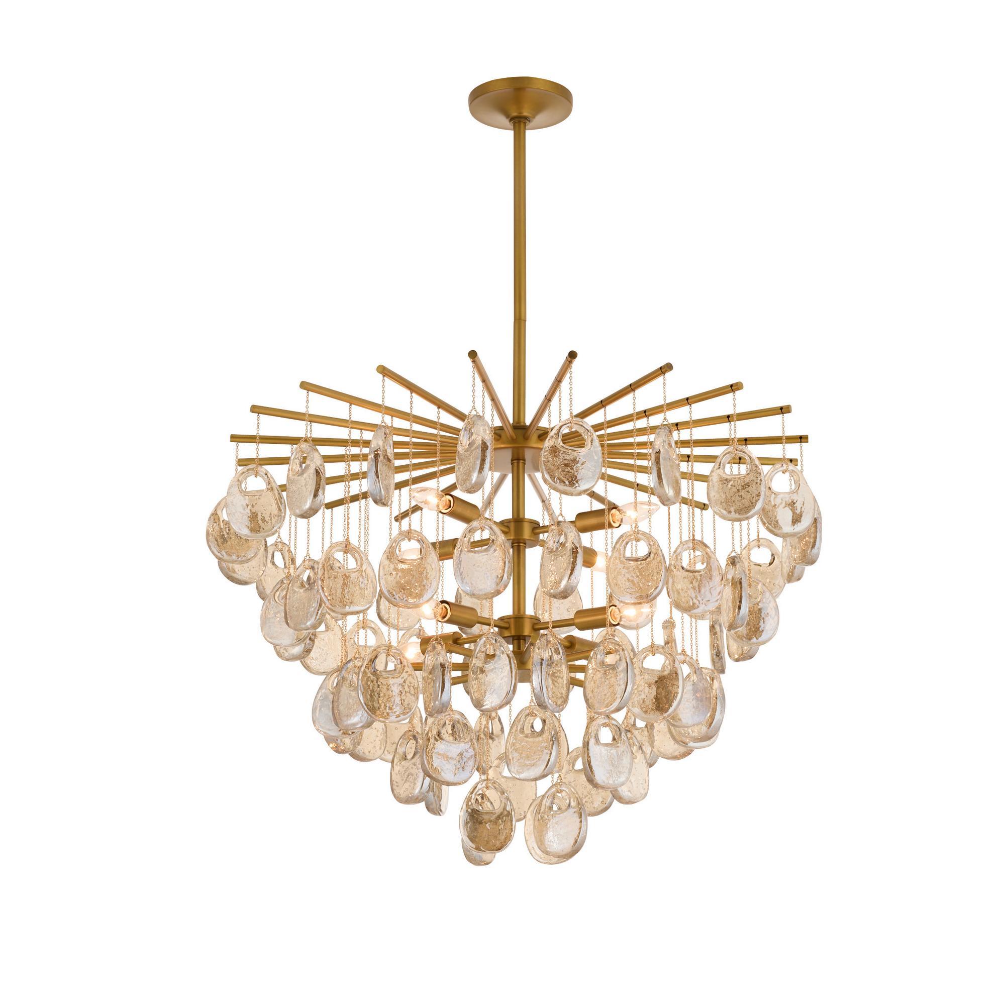 Round amber seedy glass drops are suspended in a cascading wind chime-inspired silhouette from an armature of antique brass-plated steel.