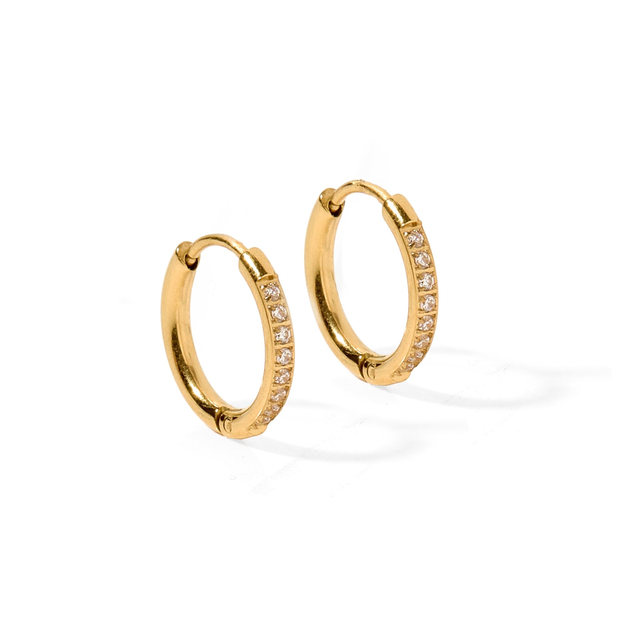 Scarlett Gold 12mm Huggie Earrings feature sparkling CZ stones for effortless shine. Waterproof, hypoallergenic, tarnish-resistant, and crafted for lightweight, comfortable everyday wear.