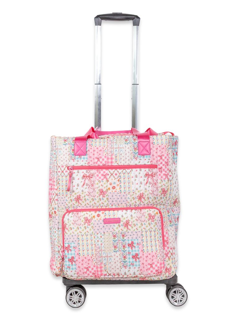 The Swivel Rolling Tote combines lightweight quilted construction with smooth glide swivel wheels, roomy interior storage, and stylish patterns for effortless travel and everyday use. 