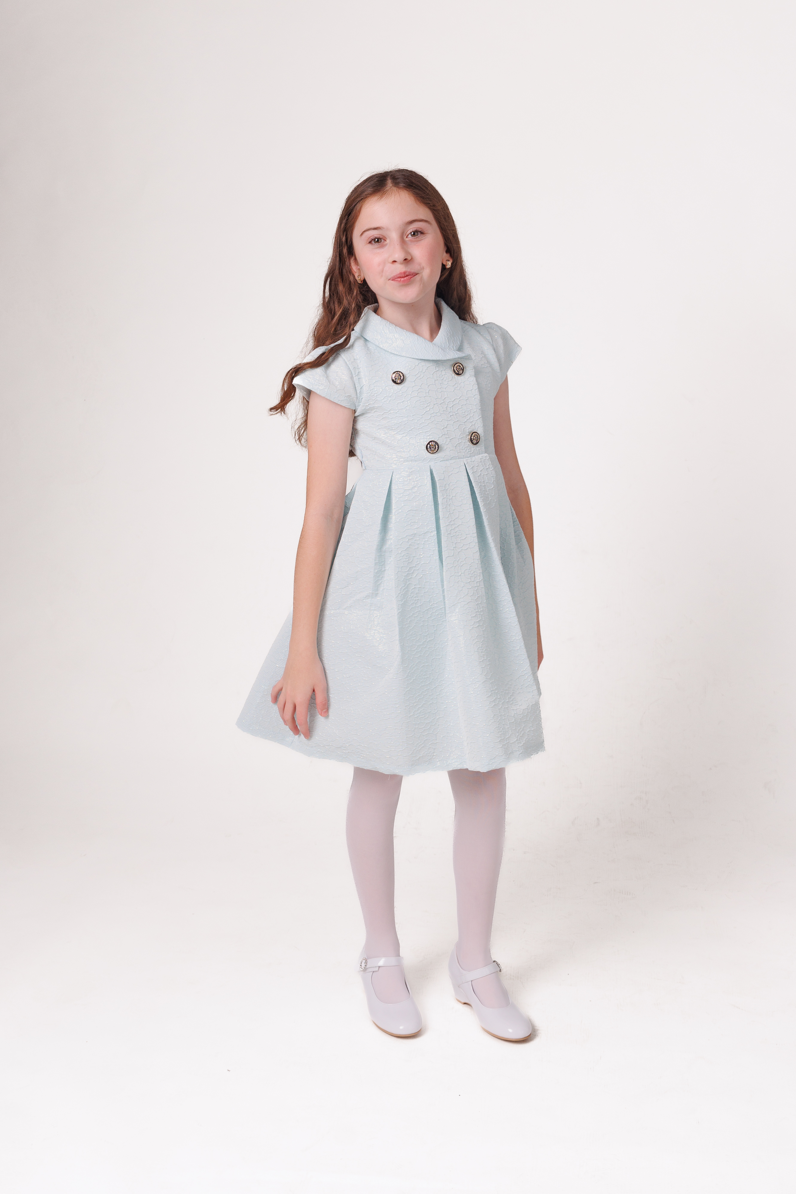 Light blue, knee length dress with double breasted details and round collar.
