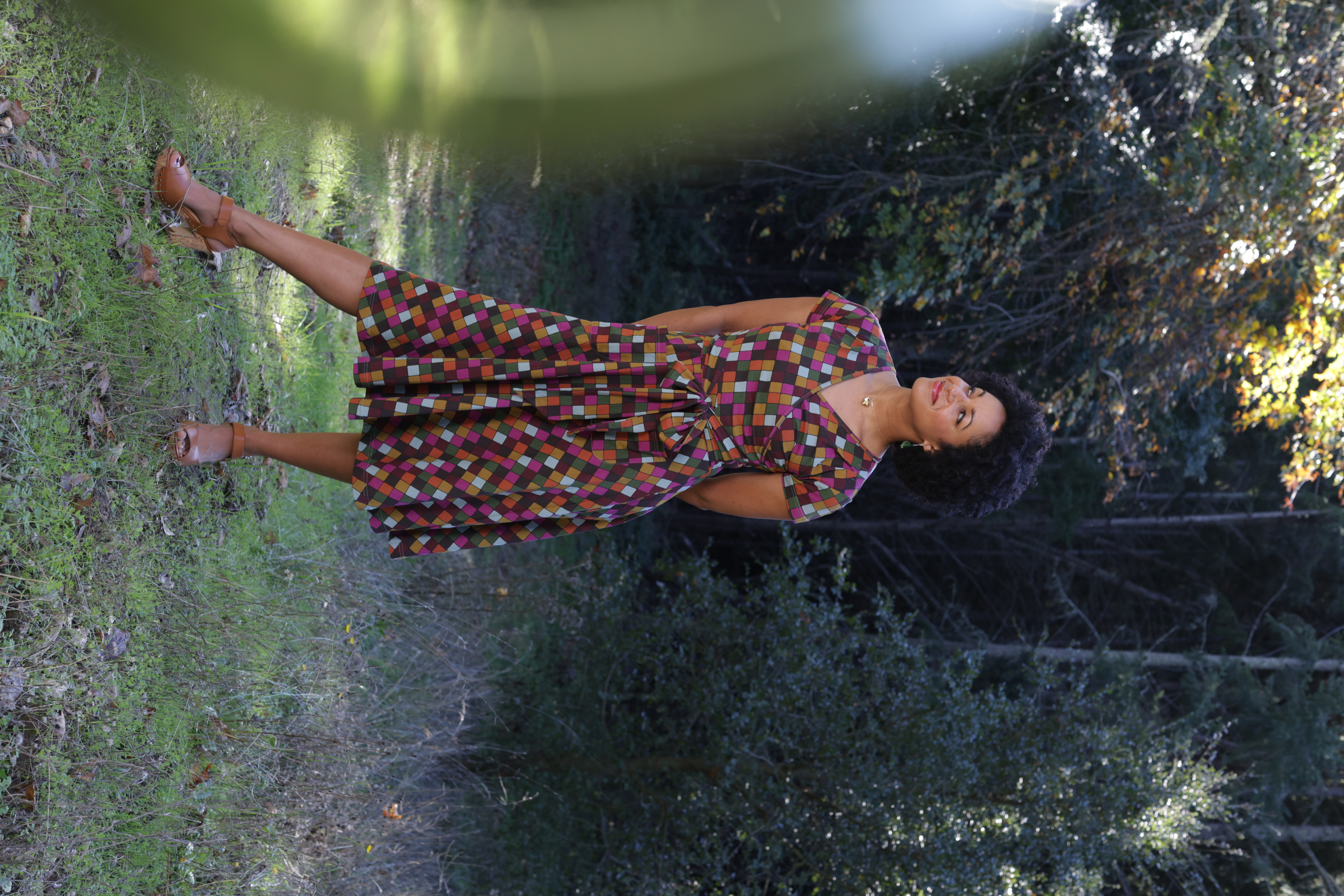 A classic wrap dress in a geometric jewel tone print.