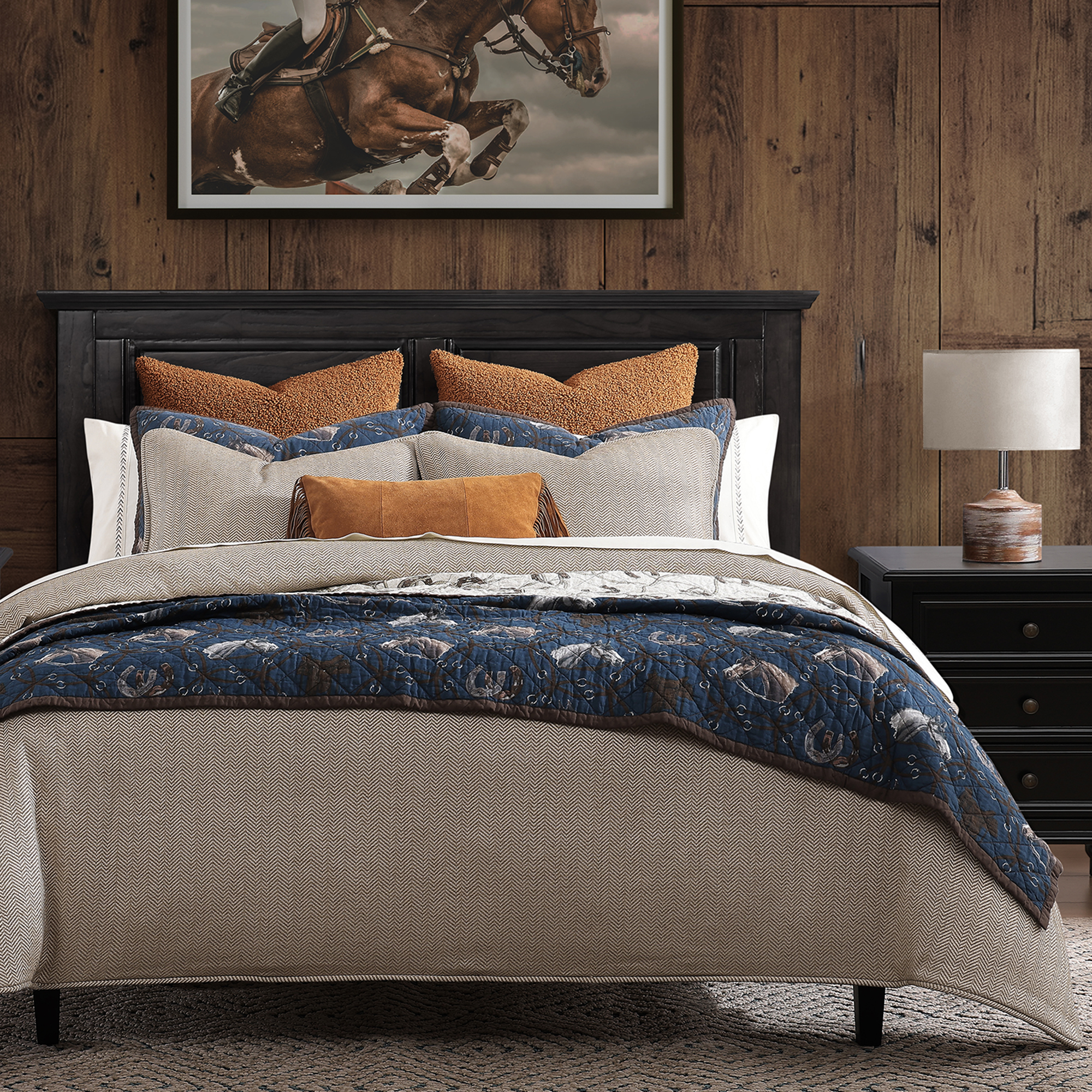 On the front, it features the Saratoga print of equine imagery encircled by bridles and bits, set on a classic navy blue base.