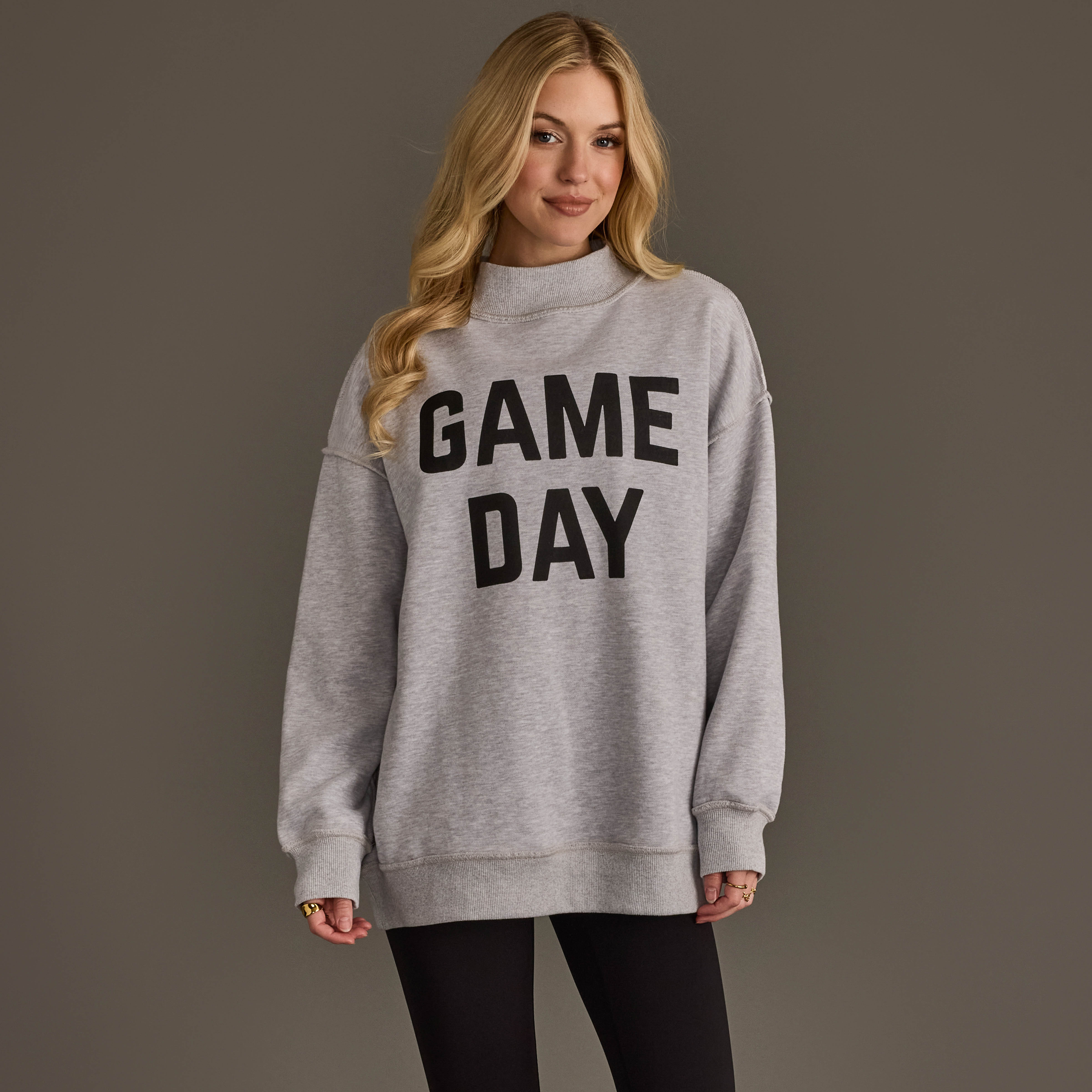 The Light Gray Game Day & Sunday Funday Reversible Sweatshirt features bold "Game Day" text on one side and "Sunday Funday" on the reverse, created using screen printing for a clean and durable design