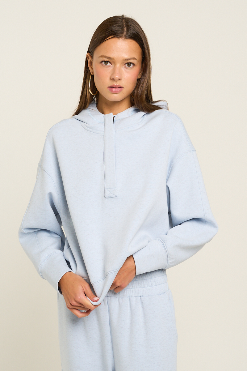 A relaxed fit hoodie crafted from ultra soft fabric for all day comfort. Features a convenient half zip detail and a soft mock neck for added warmth. M2767