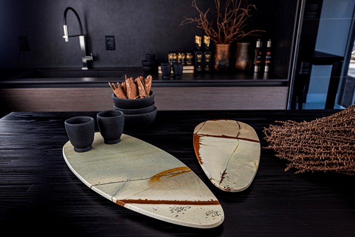 Raindrop trays carved from natural quartzite. Organic elegance and tactile beauty to modern living spaces.