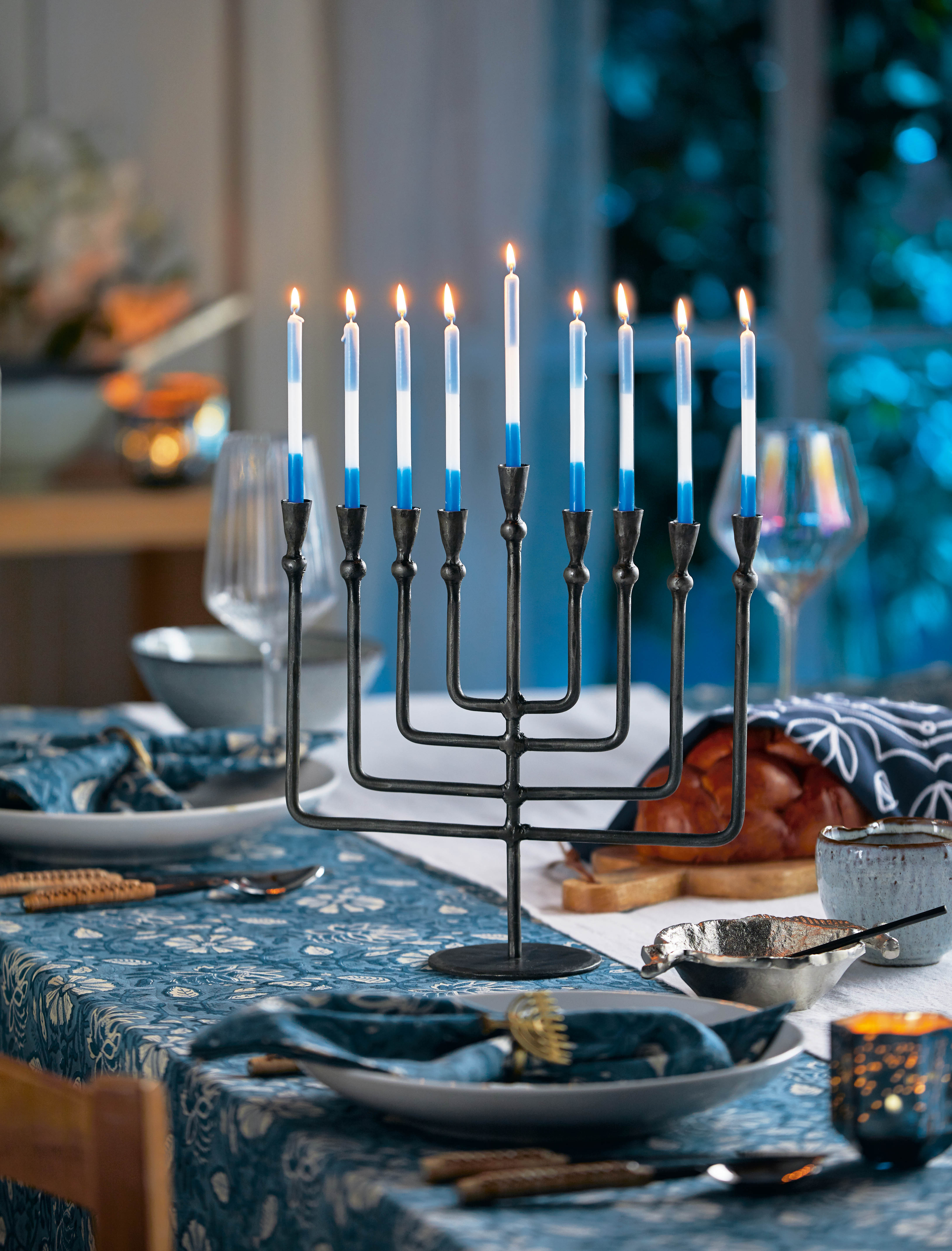 Elegant blues, silver accents, and shining details inspired by the Festival of Lights. A meaningful and beautiful collection made for gathering and celebration.