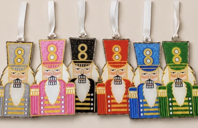 Acrylic ornaments featuring Emily Cobb’s original artwork. Each ornament measures approximately 4–5" x 2.5–3.5" and includes a ribbon for hanging.