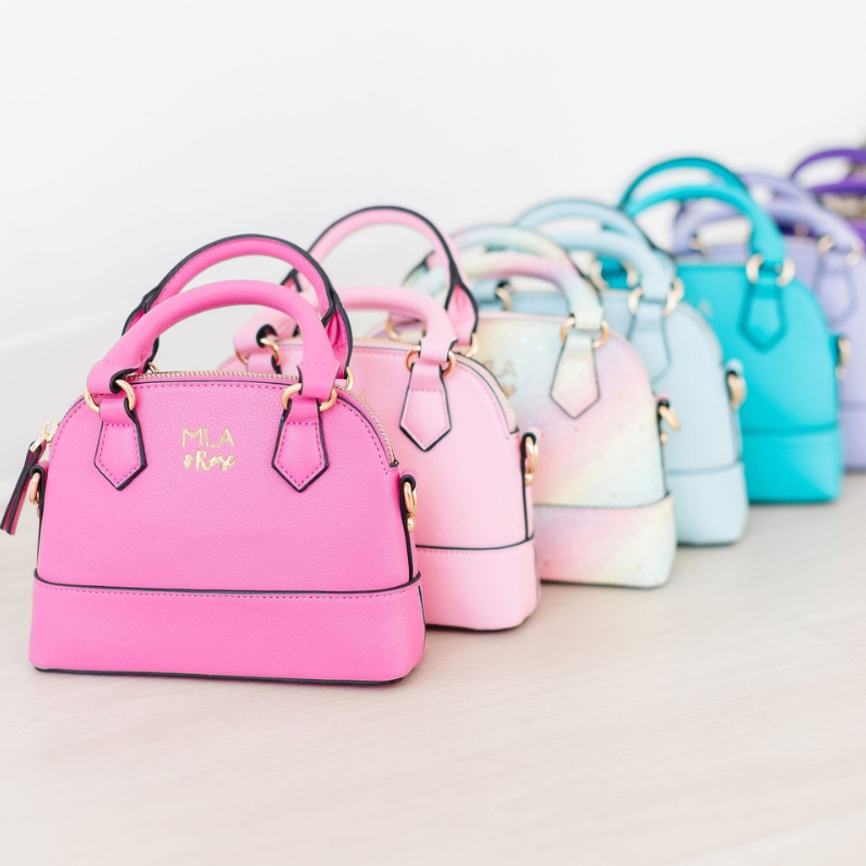 Because every little girl needs a purse! Also includes a cross body strap