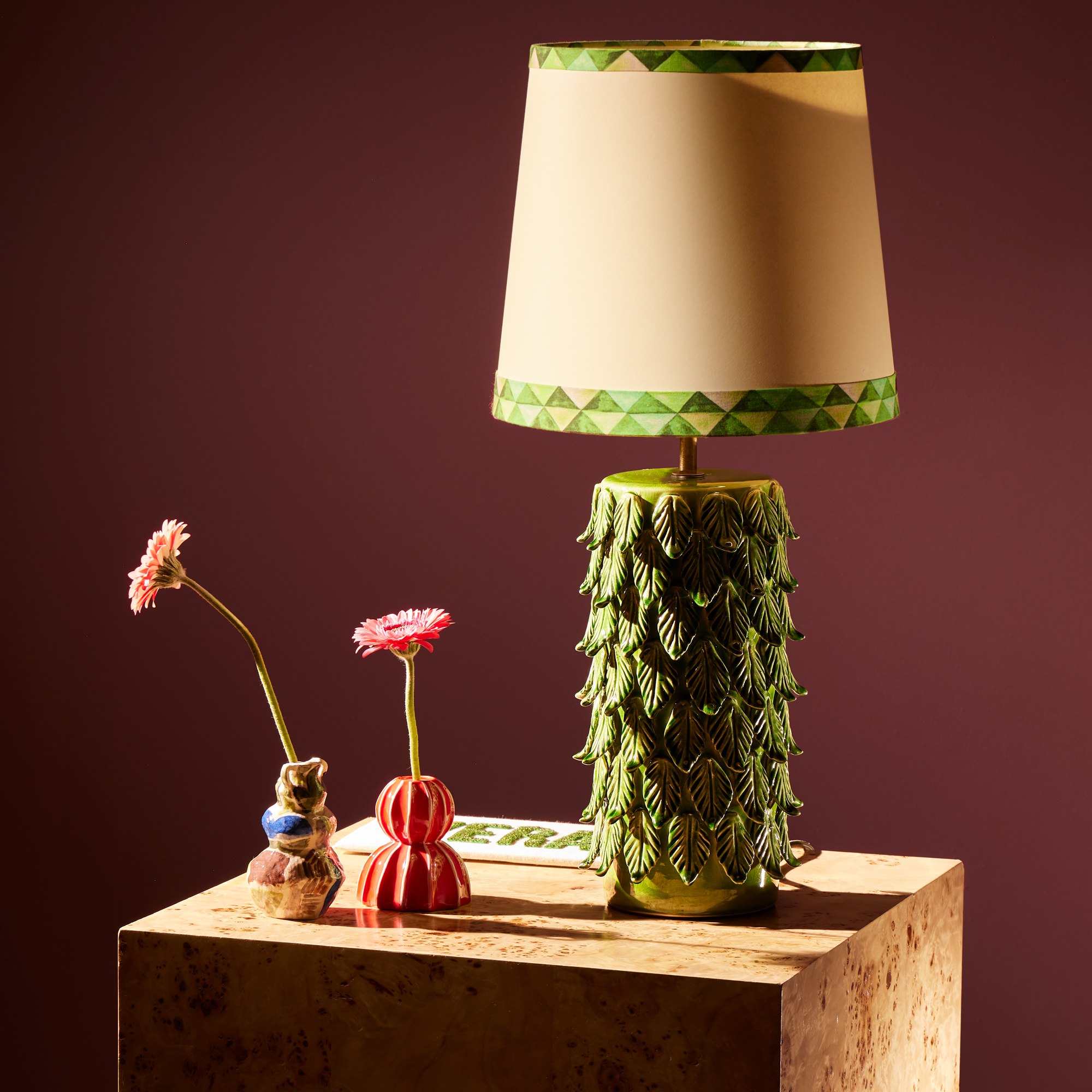 We set about making hundreds of tiny leaf like motifs to lay over the cylindrical base. The overall effect is ornate and intricate as the leaves take on a delicate feather-like quality.