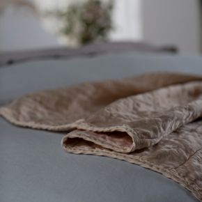Quilted charmeuse backed in cotton sateen throw blanket in Pearl.