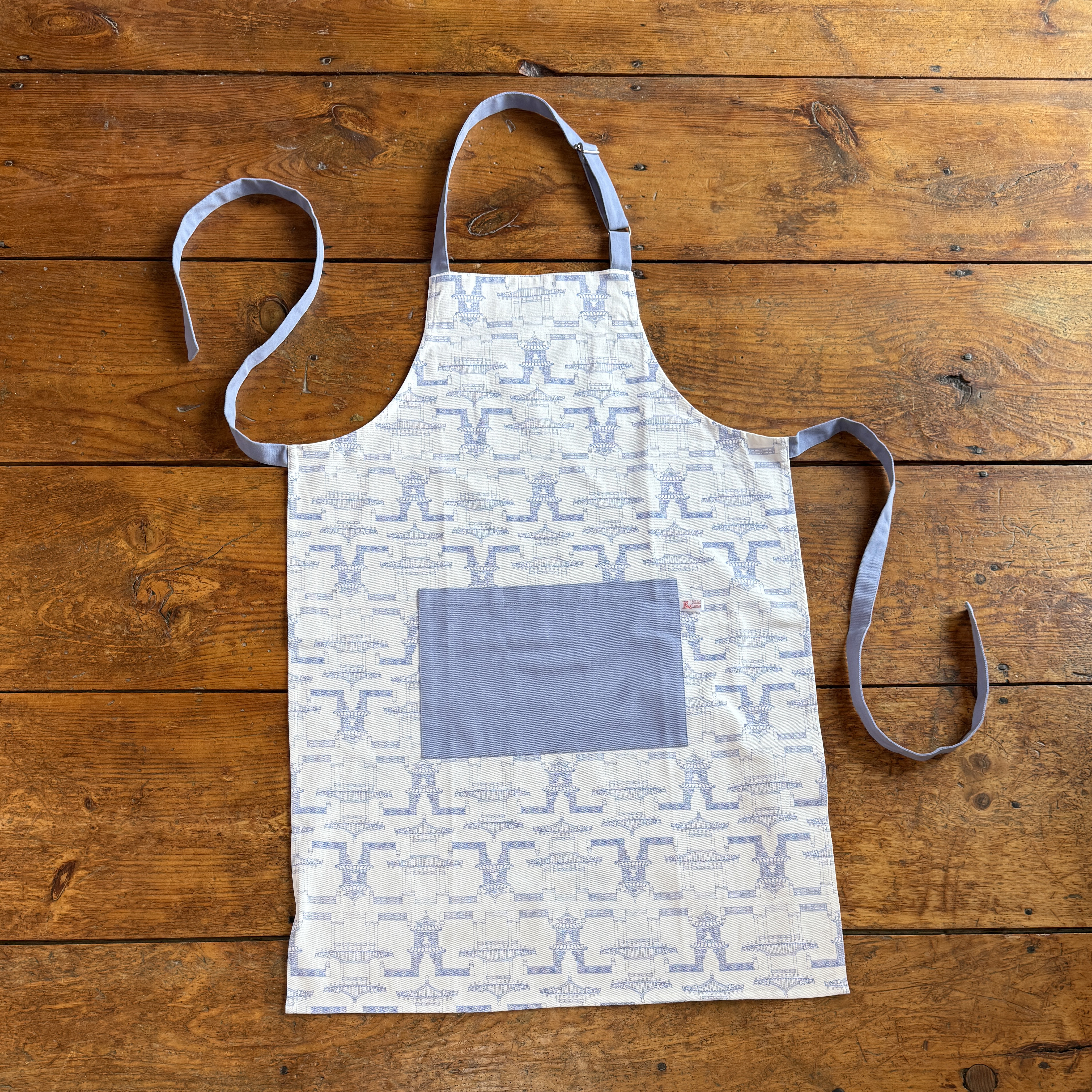 Original Hand Painted Art,  Printed on 100% Cotton Twill ,  With Adjustable Neck Strap and generous pockets.