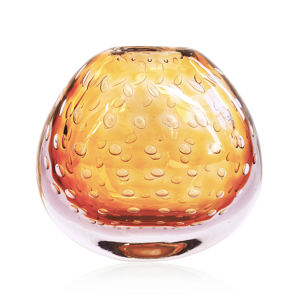 Golden amber vase with suspended bubbles.