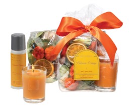 Orange Valencia trio gift set includes room spray, votive candle and decorative fragrance.