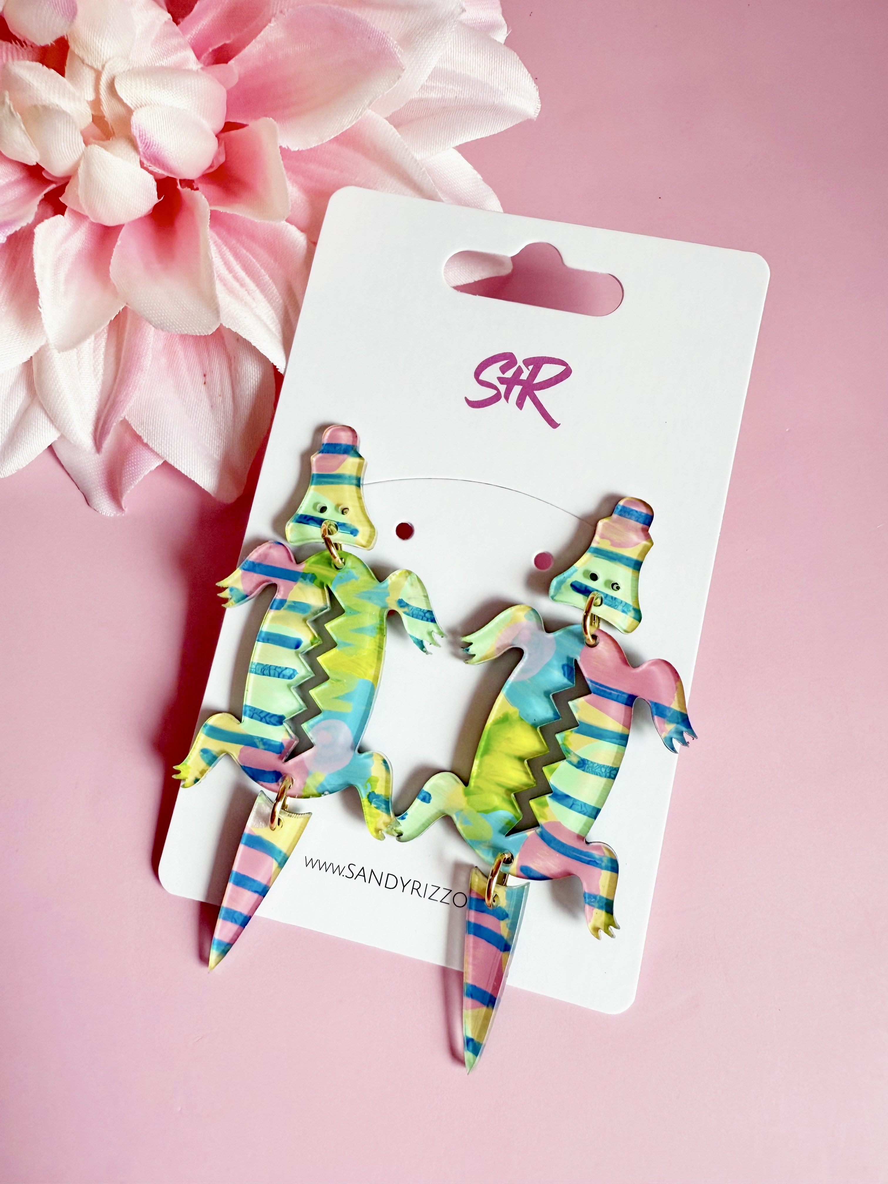 Our newest hand-painted acrylic alligator dangle in bright green, pink, yellow and blue! Each pair is a work of art and colors will vary.