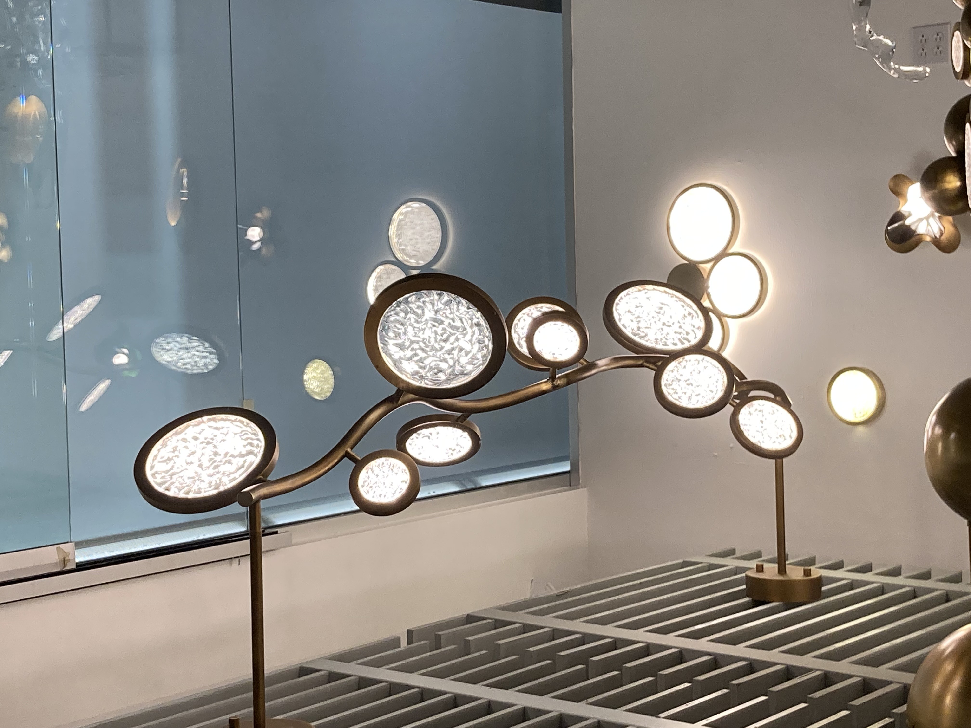 The Circle design: Ingenious the combination of Glass and brass circles radiates with unparalleled beauty. That gives your space a soft warm glow: a contemporary and modern work of art