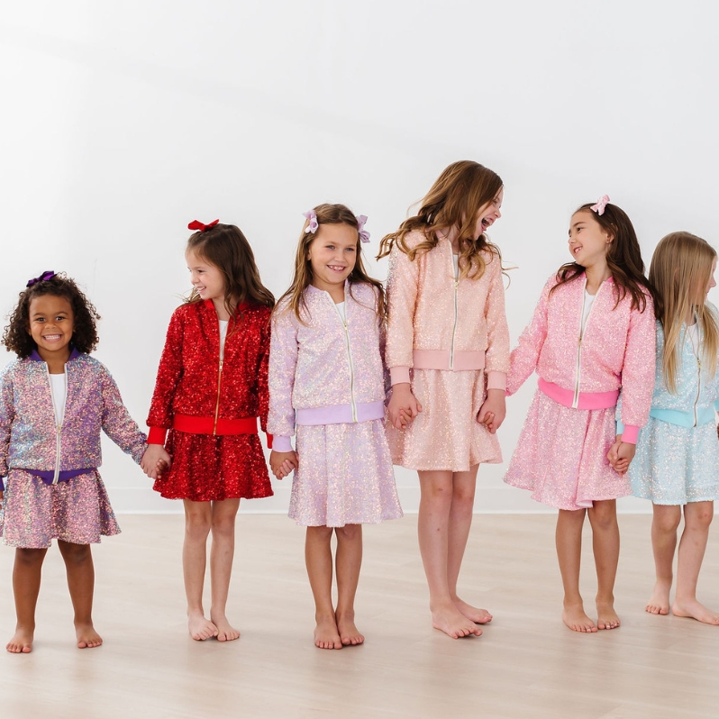 It's time to sparkle! Available in a jacket, skort, joggers, and sequin dress.