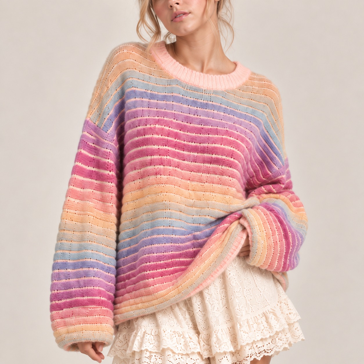 Soft open-knit sweater featuring dreamy pastel stripes. Designed with a crew neckline, drop shoulders, long sleeves, and a relaxed oversized fit for an effortless cozy look.