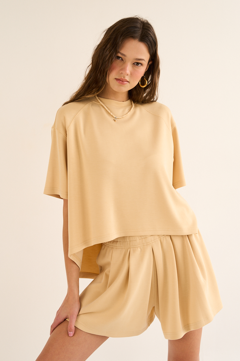 With the silhouette of a skirt and the ease of shorts, this piece is all about feminine versatility. Front wide pleats give the illusion of a flowy skirt, while it is actually shorts. P2480