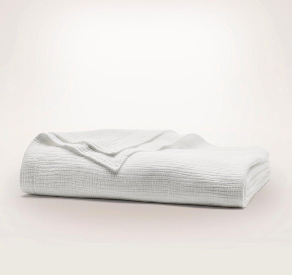 Light, airy, and unbelievably soft—this Bed Blanket is made with 4 layers of pre-shrunk organic cotton for a cozy, cloud-like feel and touchable texture.