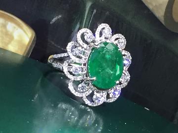 Natural emerald and diamond ring