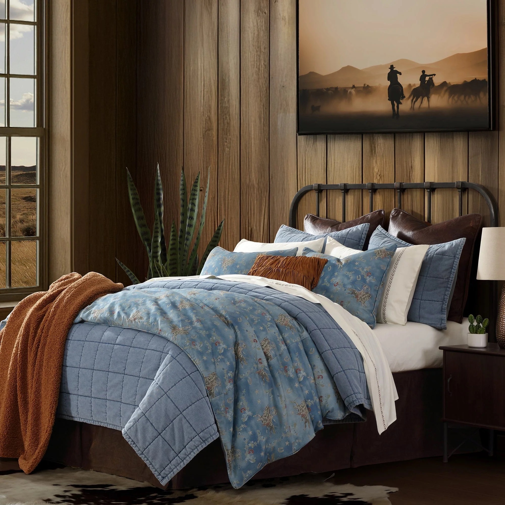 Embrace Western artistry with the Lee Western Washed Denim Bedding Set, our spin on an iconic Tasha Polizzi print.