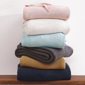 A versatile and ultra-soft layering piece for all seasons, perfect for curling under or throwing over your favorite bed, couch or person.