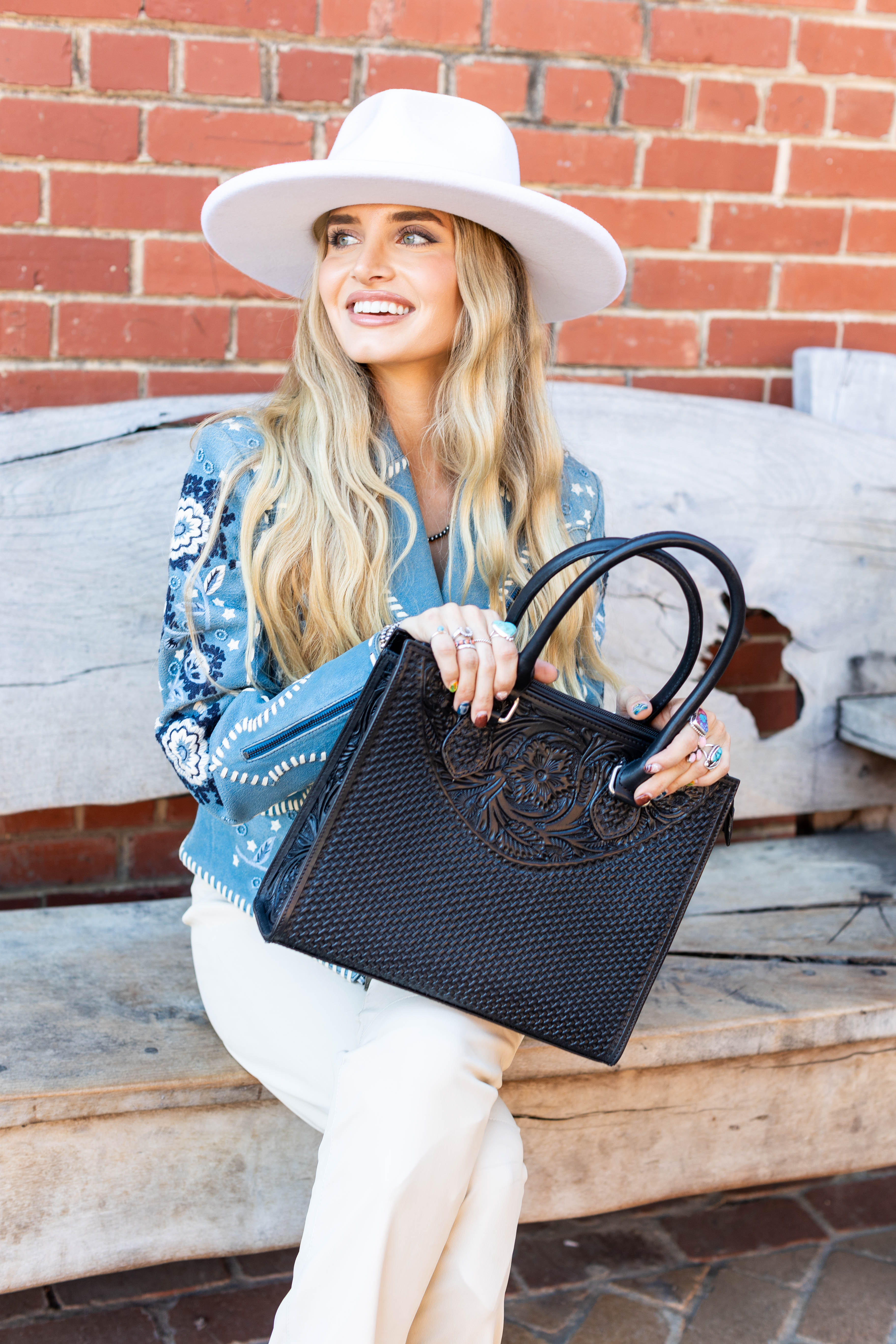 This beautiful leather, fully tooled tote bag is the perfect accessory for any occasion 