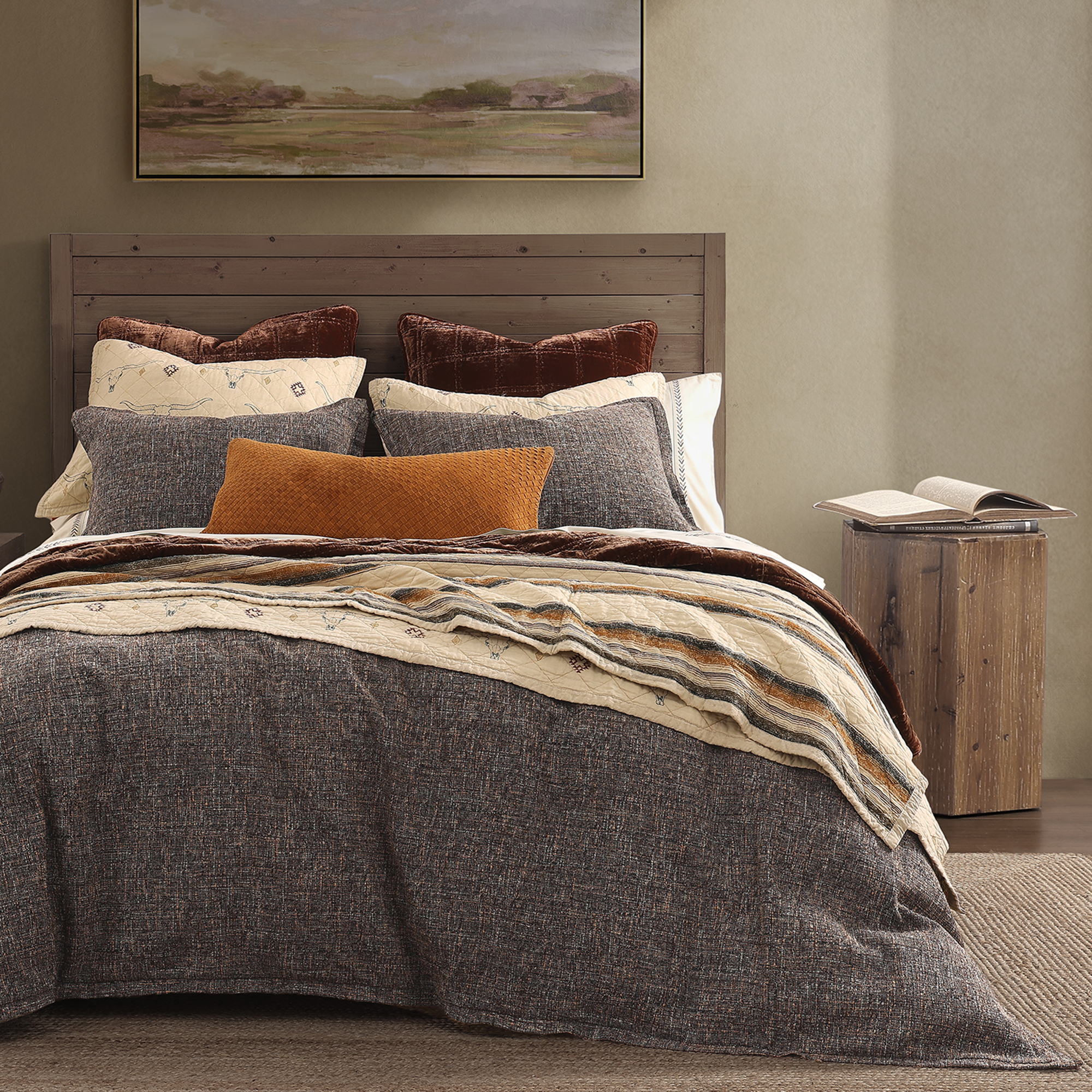 Maverick is a reversible quilt featuring Texas Longhorns accented by classic Western symbols on the front, while the reverse showcases a charming design inspired by 1970s vintage truck upholstery.
