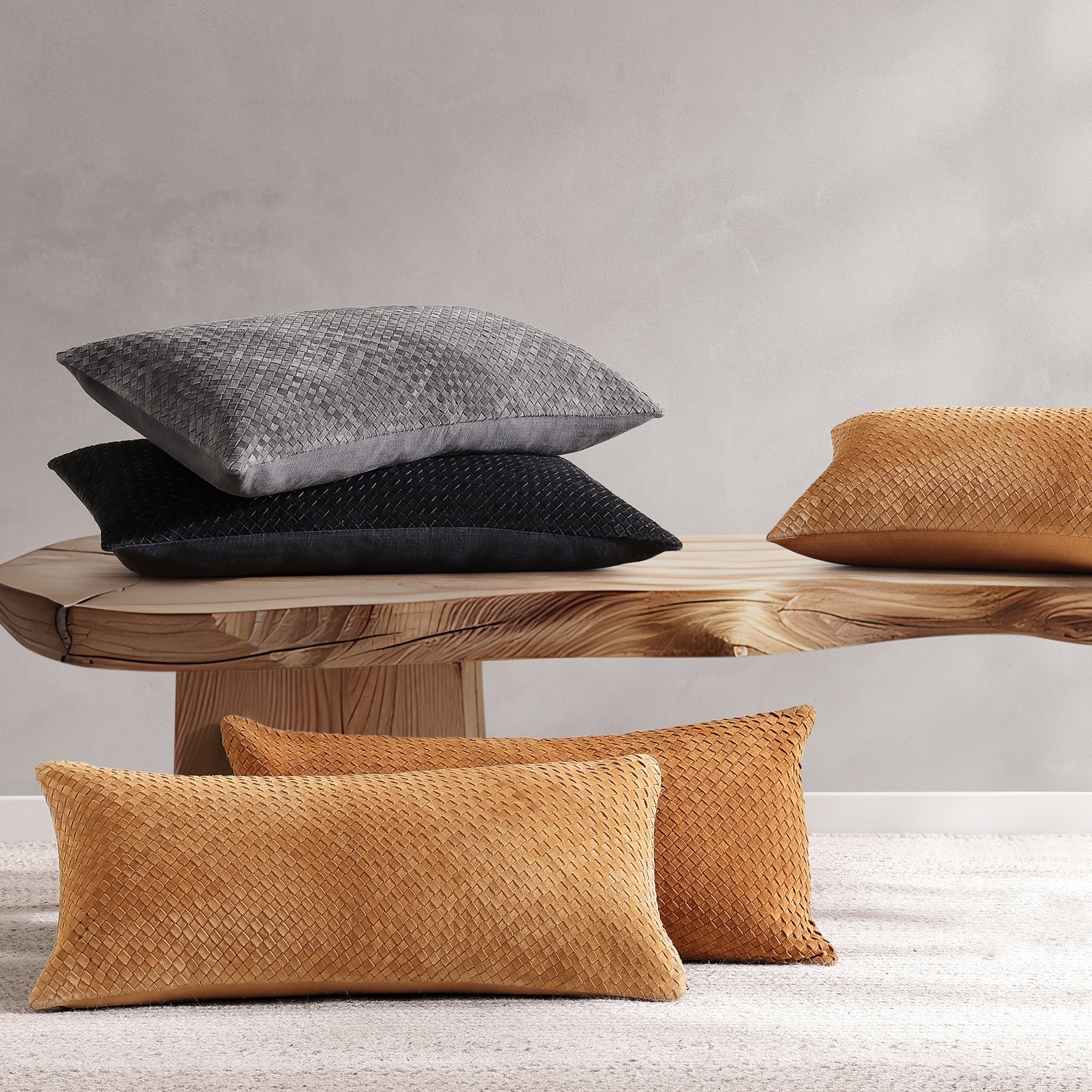 Showcasing genuine suede hand-woven into a criss-cross pattern, this throw pillow brings the perfect mix of rustic and chic to any room.