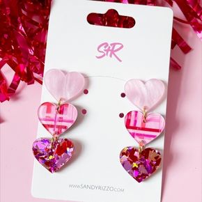 Three hearts, infinite charm! This adorable triple heart dangle stacks pink pearl on top, a hand-painted plaid masterpiece in the middle, and festive Valentine's confetti at the bottom.