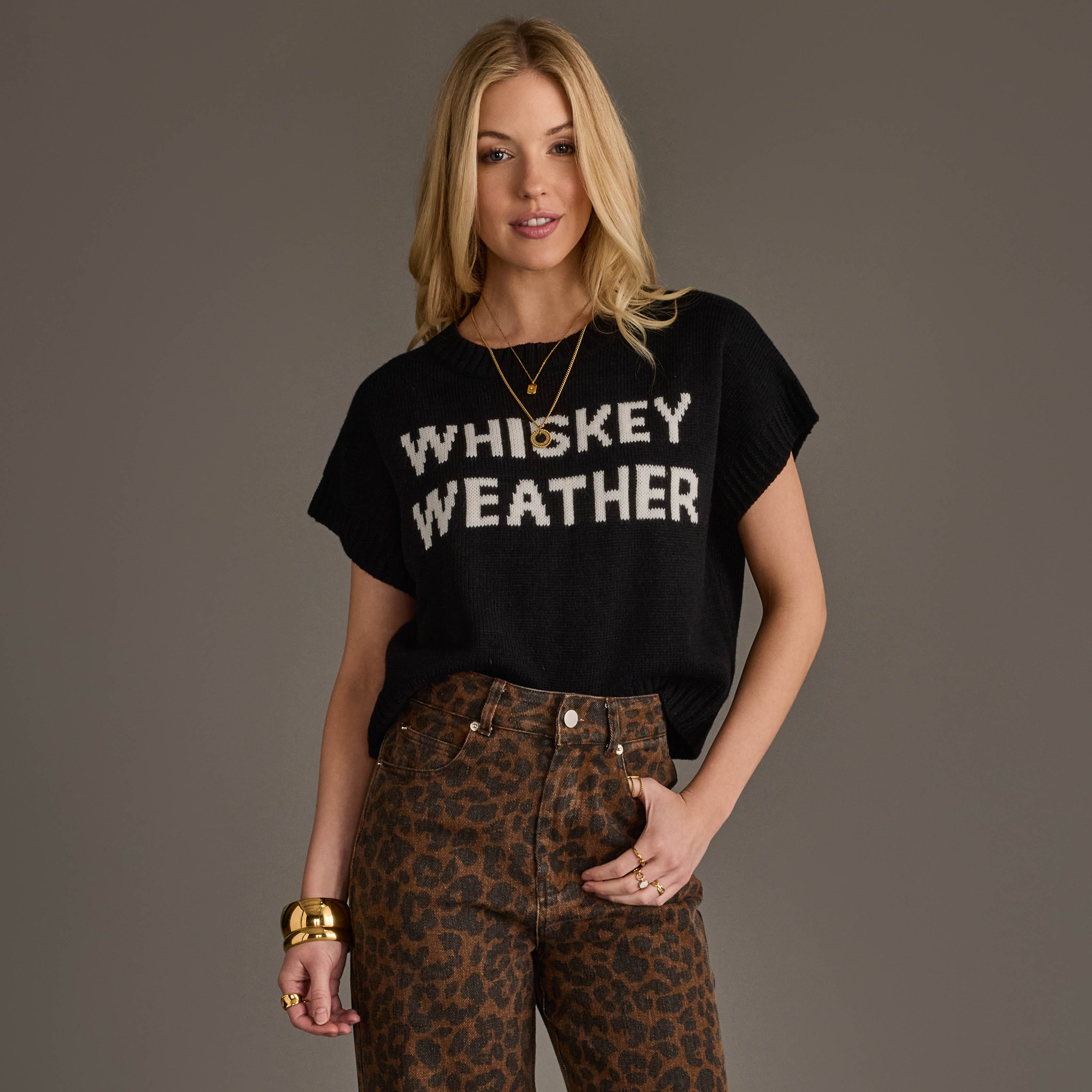 Whiskey Weather short sleeve sweater designed with a classic crew neckline, relaxed fit, and ribbed trim for a cozy yet elevated look perfect for cool days, casual outings, or seasonal layering.