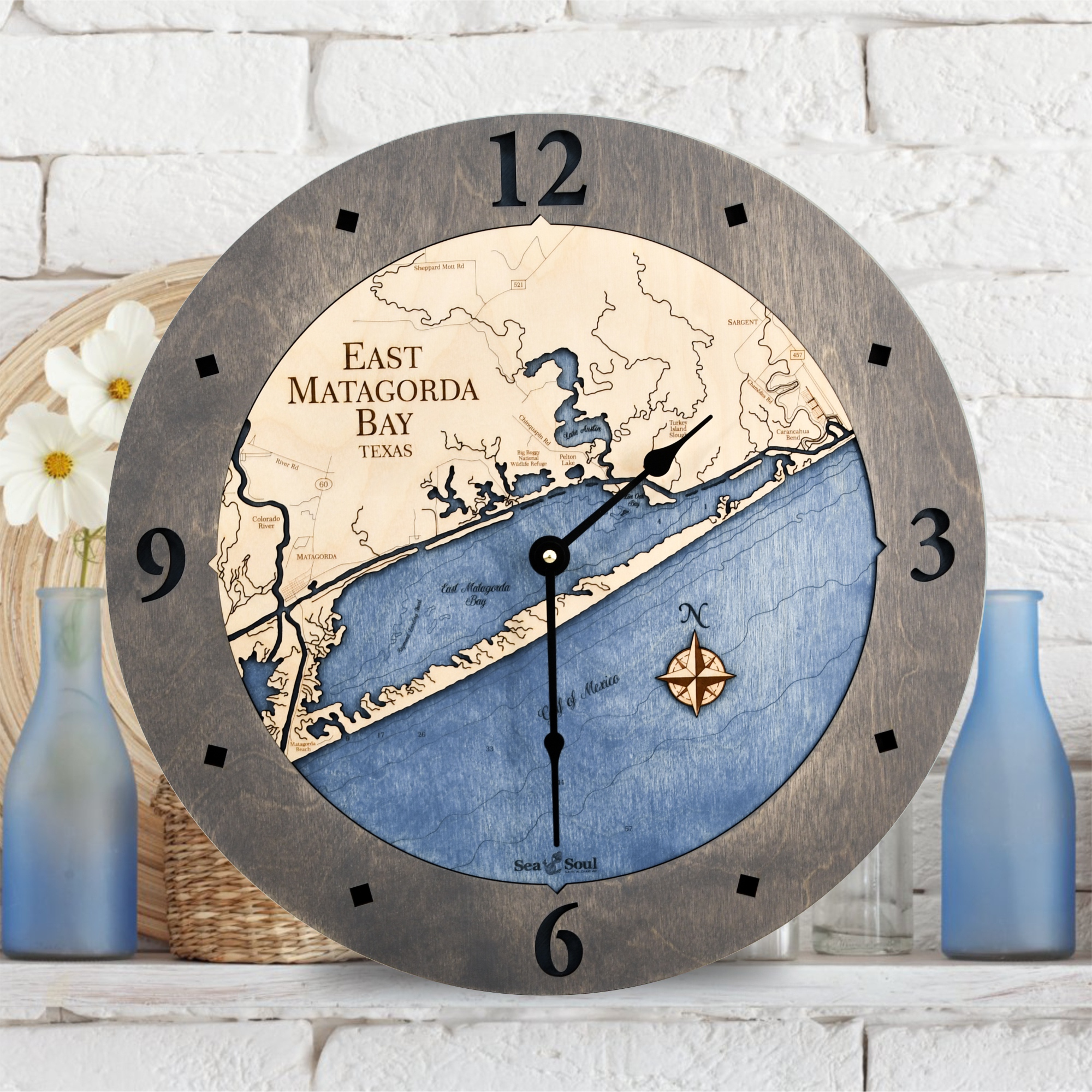 East Matagorda Bay Wall Clock shown in Bleached blue Accent Ring with Deep Blue Water