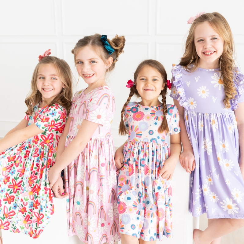 Our best selling, classic style! Available in a short sleeve style, 3/4 sleeve, tank, and flutter sleeve. Solids & prints!