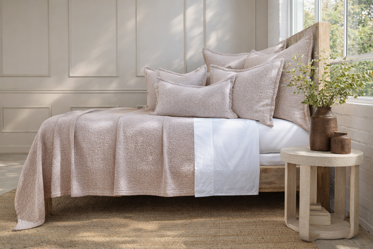 Crafted in Portugal, the Malibu Matelasse Blanket features small, speckled stitching that creates a softly textured surface with a relaxed feel.