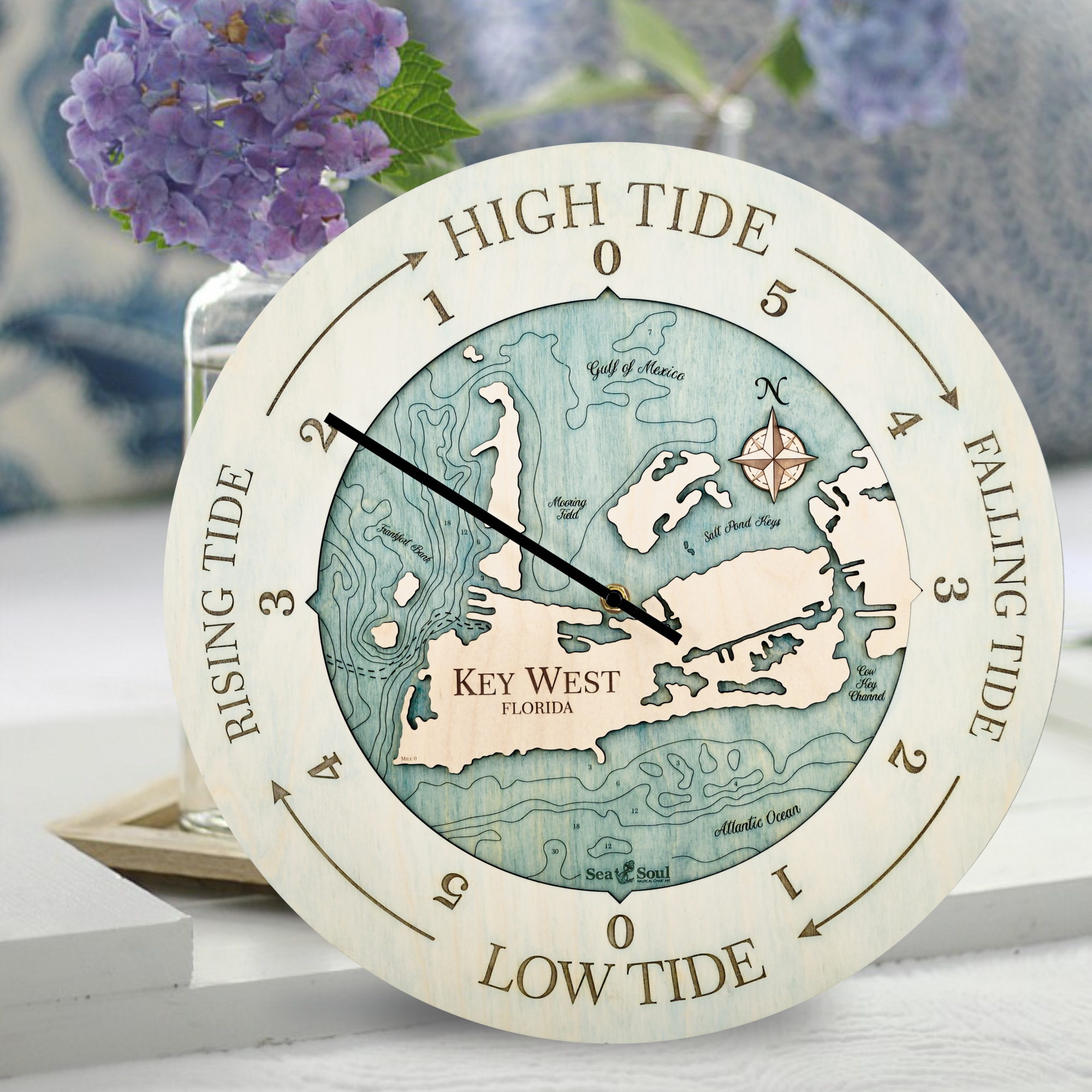 Key West Tide Clock shown in Bleached Blue Accent Ring and Blue Green Water
