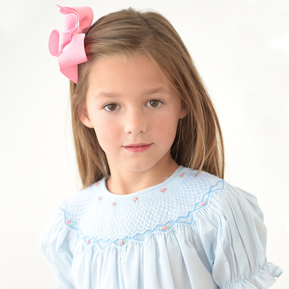 Light Blue Bishop dress with English smocking. Puff sleeves, buttons in back.